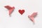 Pink Birds and Red Heart of origami on white background. Gift ca