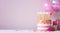 Pink birthday cake with golden candles