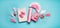 Pink birthday holidays party accessories : gift boxes with ribbon, wrapping paper, chocolate lolly pops , party fan and decor
