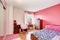 Pink with black and white teenager\'s girls room.