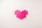 Pink block heart on white background