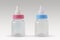 Pink and blue baby bottles - Male or female? Concept of future baby gender