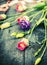 Pink and blue garden flowers on old wooden table