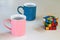 Pink and blue mugs and a puzzle.