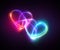 Pink blue neon light drawing, couple of hearts, romantic symbols, abstract doodles isolated on black background.