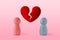 Pink and blue pawn with broken heart - Concept of love ending and divorce