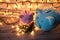 Pink and blue piggy bank with glittering lights, organize parties for successful activities to save money for retirement