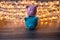 Pink and blue piggy bank with glittering lights, organize parties for successful activities to save money for retirement