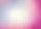 Pink blurred background with light blue.