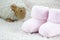 Pink bootees for babies with one toy sheep