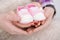 Pink booties for newborn baby in hands of mum and dad. pregnancy