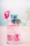 Pink Bottle of floral perfume with flowers, natural cosmetic product or beauty concept on pastel background