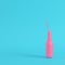 Pink bottle with straw on bright blue background in pastel color