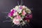 Pink bouquet from gillyflowers and alstroemeria on blackboard, t