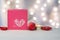 Pink box with heart and christmas decorations.