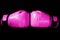 Pink Boxing glove in punching  in black background in woman concept