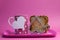 Pink breakfast tray with polka dot coffee tea cup mug and heart shape toast rack with wholemeal toast for Mothers Day, birthday or