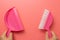 Pink broom and dustpan isolated on pink background