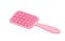 Pink brush for detangling and combing hair, hairbrush with plastic teeth for grooming