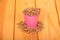 Pink bucket with peeled fried sunflower seeds and seeds around o