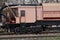 Pink cabin repair locomotive stands on the railroad