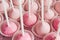 Pink cakepops on platter, closeup