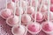 Pink cakepops on platter, closeup