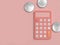 Pink calculator and three silver coin on pink floor minimal 3d render