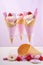 Pink candy ice creams in cones.