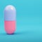 Pink capsule pill on bright blue background in pastel colors