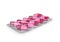 Pink capsules in the package