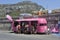 A pink caravan carrying souvenirs from the Tour de France