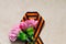 Pink Carnation with St. George ribbon on craft background, symbol of the great Victory, symbol of world war II