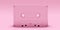 Pink cassette tape isolated on pink background