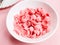 Pink Cereal with strawberry flavour in white bowl