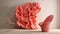 Pink Chair And Coral Sculpture: A Voluminous And Detailed Art Piece