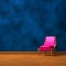 Pink chair near an abstract wall