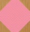 Pink Checkered Tablecloth on Brown Oak Wooden Table