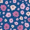 Pink cherry blooms on a classic blue background seamless vector pattern