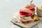 Pink chicken grill burger on wood background