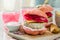 Pink chicken grill burger on wood background