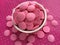 Pink Chocolate Candy Melts on pink polka dots Background