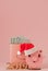 Pink Christmas pig and purse with dollars and inscription 2019 on a pink background