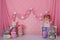 pink circus smash the cake decoration with curtains and balloon arch for photographic studio