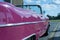 A pink classic car in Cuba