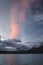 Pink cloud at sunrise over blue Waterfowl Lakes, Banff National Park, Canada