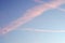 Pink clouds and contrails