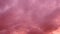 Pink clouds. Delicate hue paints the atmosphere with sense of tranquility. Dreamlike panorama. Whether during sunset or