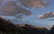 Pink Clouds Drift Above Logan Pass