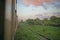 Pink clouds hover over the tracks deep in the countryside of the Burmese Railway, between Yangon and Mandalay